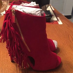 Red boots with fringe.